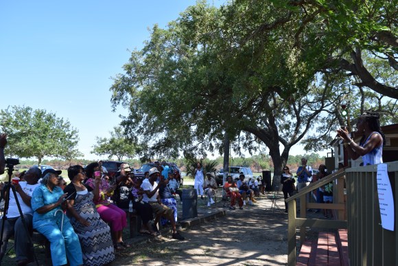 Queen Quet addresses a crowd at Mosquito Beach on James Island, South Carolina during a Gullah/Geechee Famlee Day event in July 2015. Mosquito Beach was a popular destination for Gullah/Geechees and other African Americans during Jim Crow and remains a site of significance in the Gullah/Geechee community.